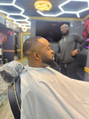 Akim’s Empire Cuts & Braiding barber shop logo