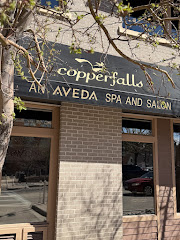 Copperfalls Aveda Spa and Salon logo