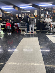 Q's Barber Shop logo