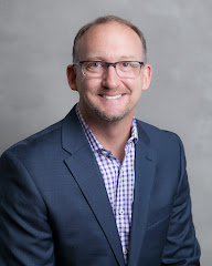 Richard Kropf, Russell Real Estate Services logo
