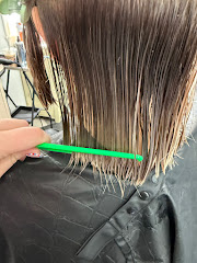 Tangles Hair Studio & Day Spa logo
