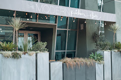 The MODERN Kitchen + Bar logo