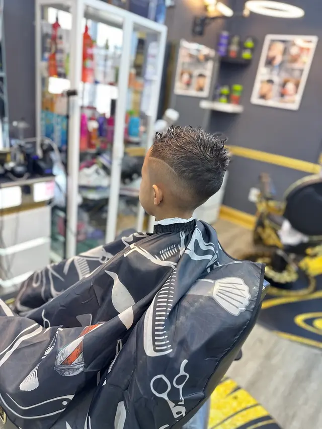 Akim’s Empire Cuts & Braiding barber shop — photo from the business 12